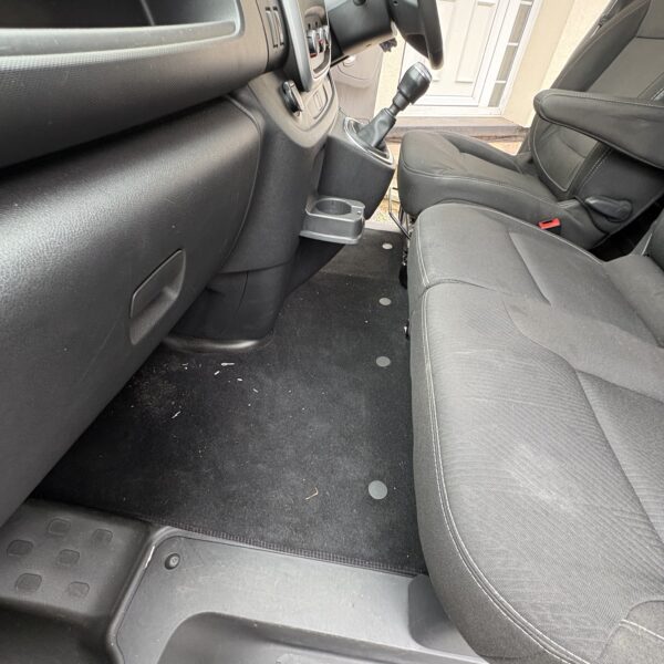 Before - front cabin footwell and seat area with debris